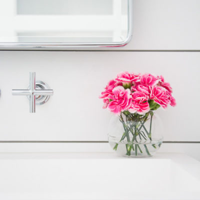 Modern farmhouse bathroom makeover featuring a wall mounted faucet