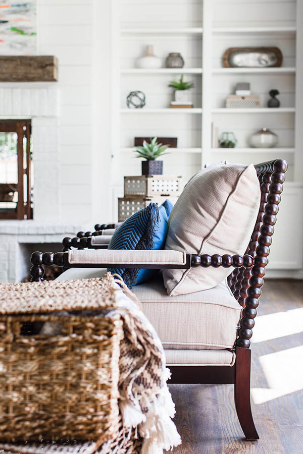 Accent chair for living room layout. Fireplace built in shelves. Neutral accent chair living room.