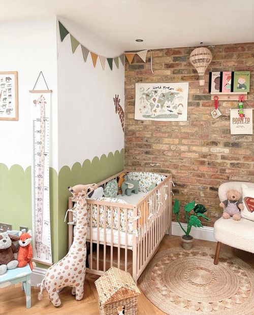 brick accent wall in babys bedroom