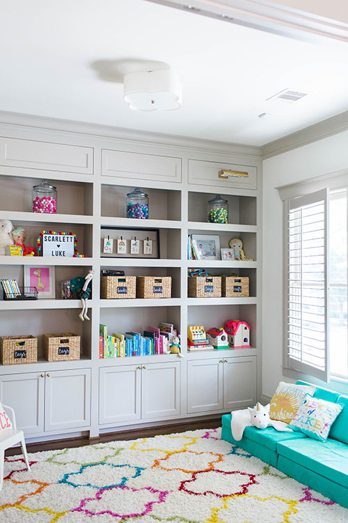 built in cabinetry for hidden playroom storage