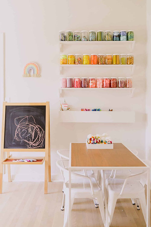 clear jars for storing craft supplies in kids playroom 