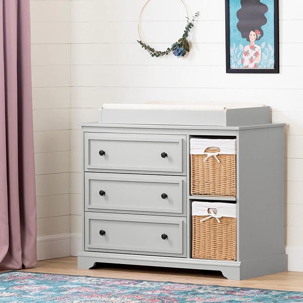 Gray nursery changing table with baskets