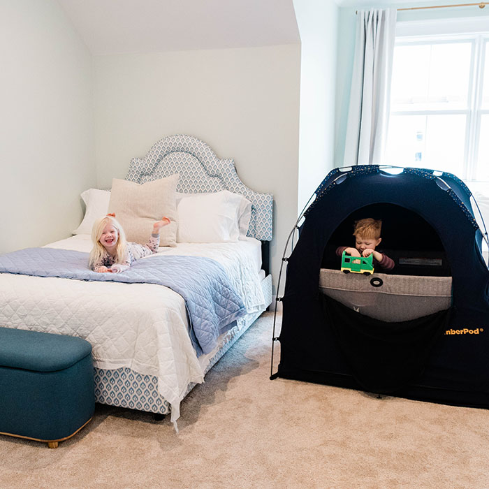 kids in bedroom with blackout tent